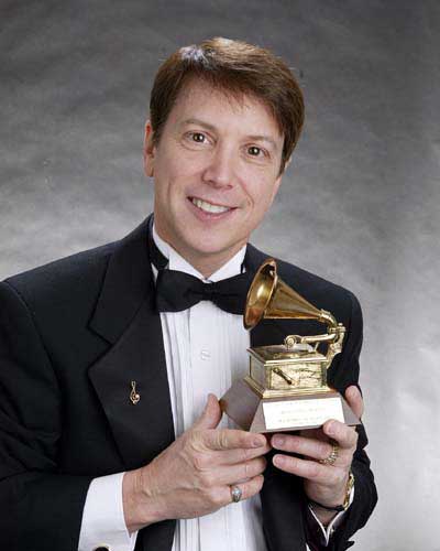 Dennis Scott holding his Grammy Award